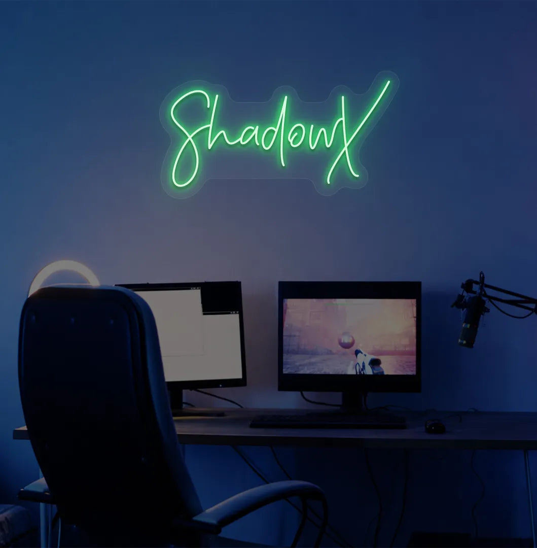 Image of a stylish personalized gamer tag neon sign mounted on decorative wall in green color.