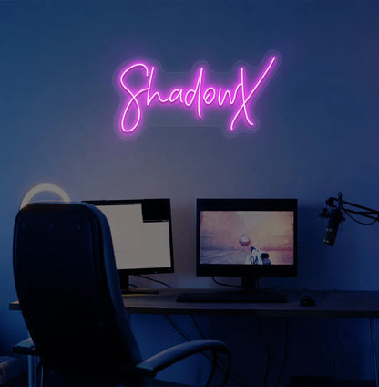 Custom gamer tag pink LED neon sign mounted on modern gaming wall.