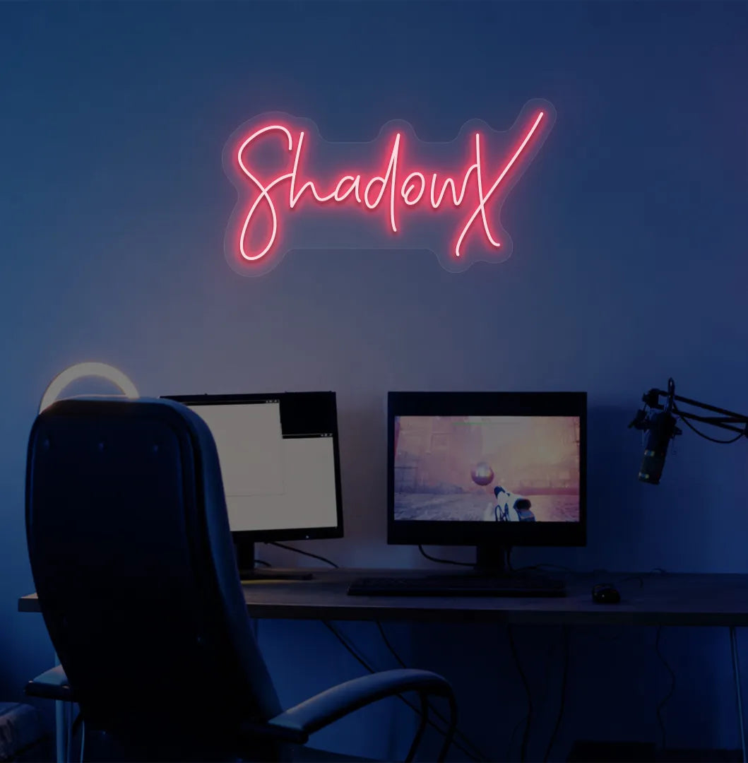 Custom gamer tag red LED neon sign mounted on modern gaming wall.