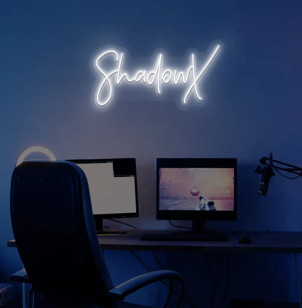 Custom gamer tag white LED neon sign mounted on modern gaming wall.