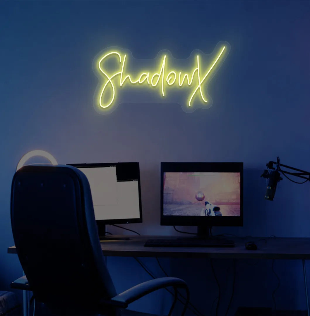 Image of a stylish personalized gamer tag neon sign mounted on decorative wall in yellow color.