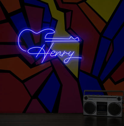 Personalized Guitar with Name neon sign in blue color mounted on modern wall decor.