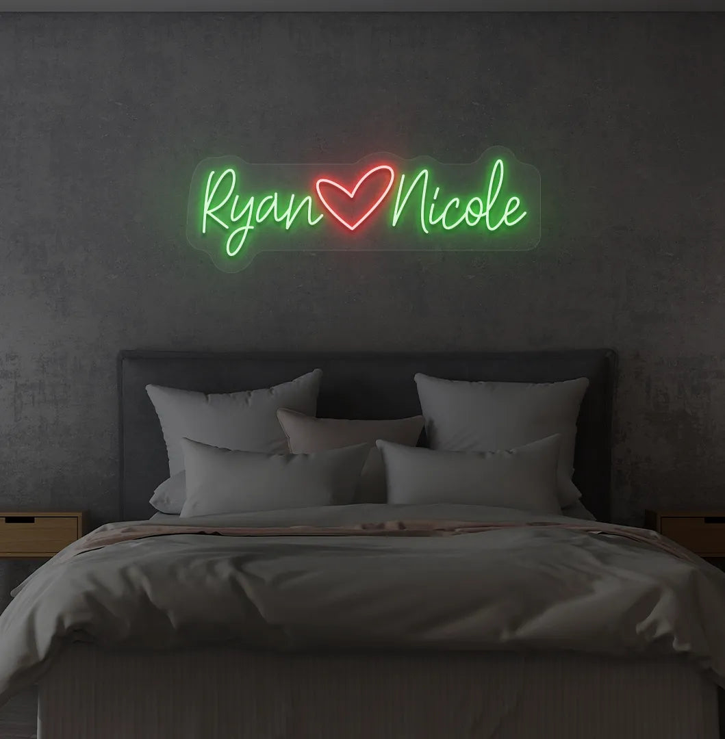 Personalized green LED name sign mounted on modern bedroom wall.