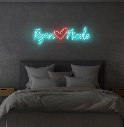 Custom Name neon sign with heart icon in ice blue color on modern wall.