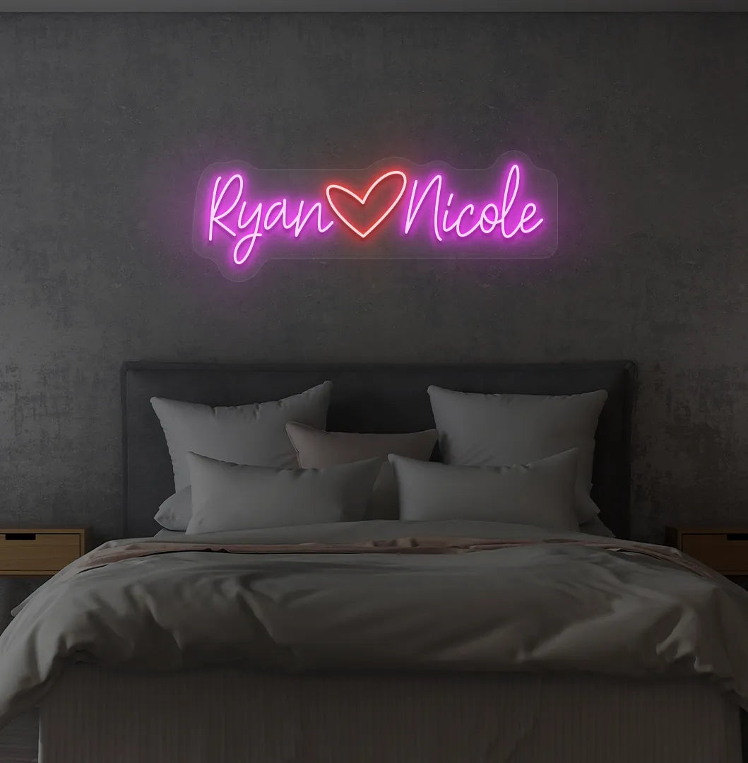 Custom Name neon sign with heart icon in pink color on modern wall.