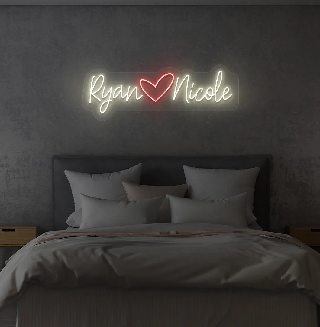 Personalized warm white LED name sign mounted on modern bedroom wall.