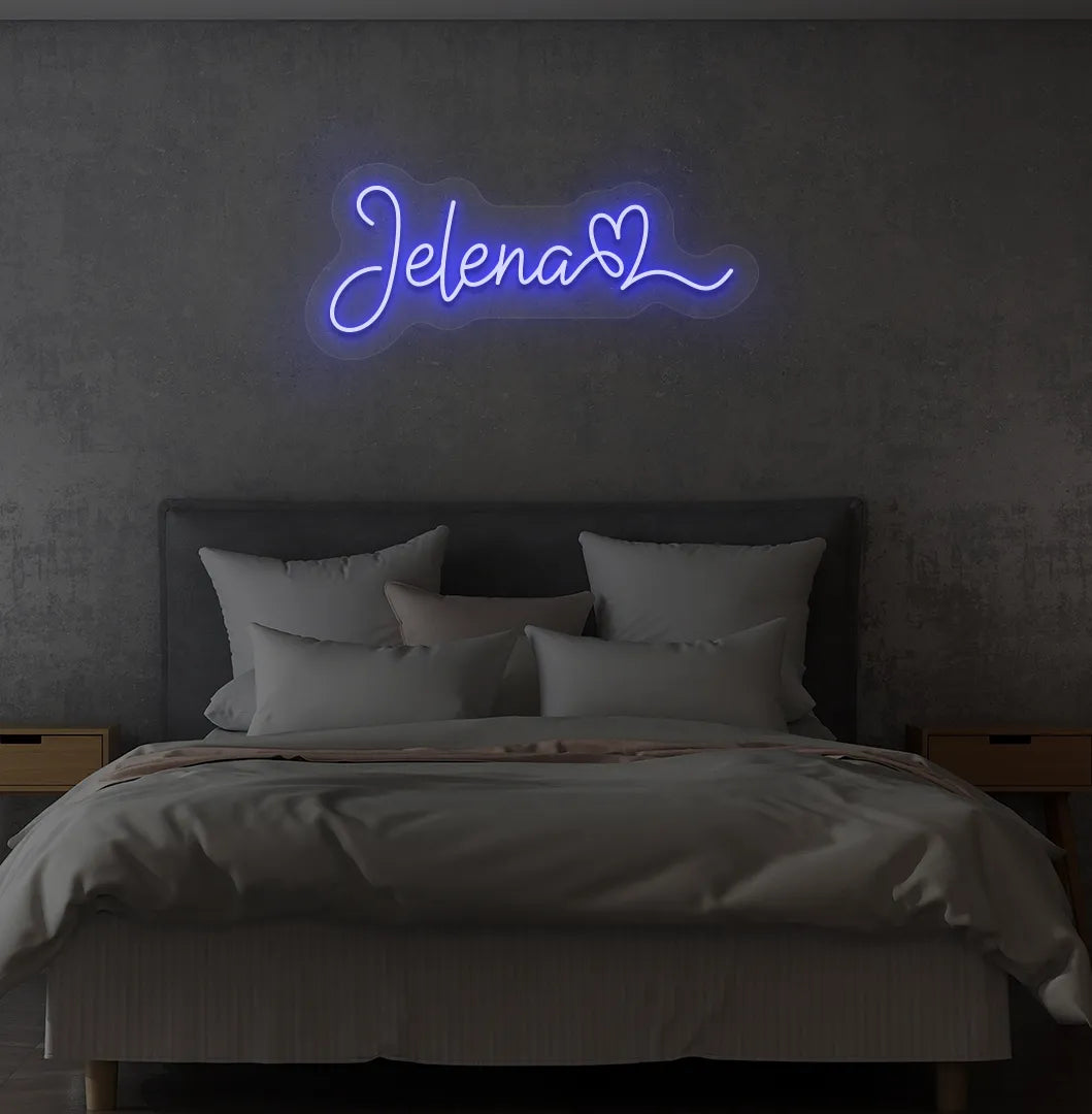Personalized Name with Heart neon sign in blue color mounted on modern wall.