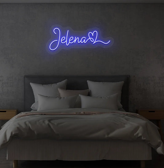 Personalized Name with Heart neon sign in blue color mounted on modern wall.