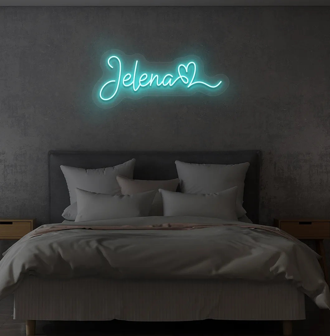 Personalized Name with Heart neon sign in ice blue color mounted on modern wall.