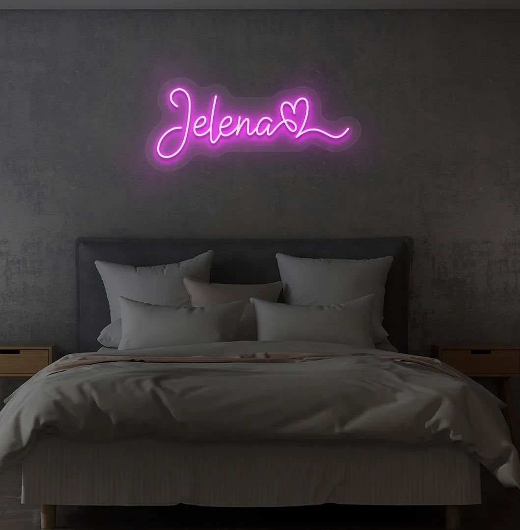 Personalized Name with Heart neon sign in pink color mounted on modern wall.