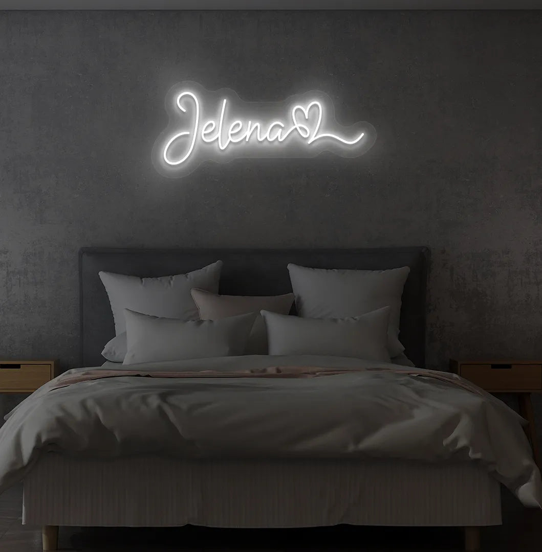 Personalized Name with Heart neon sign in white color mounted on modern wall.
