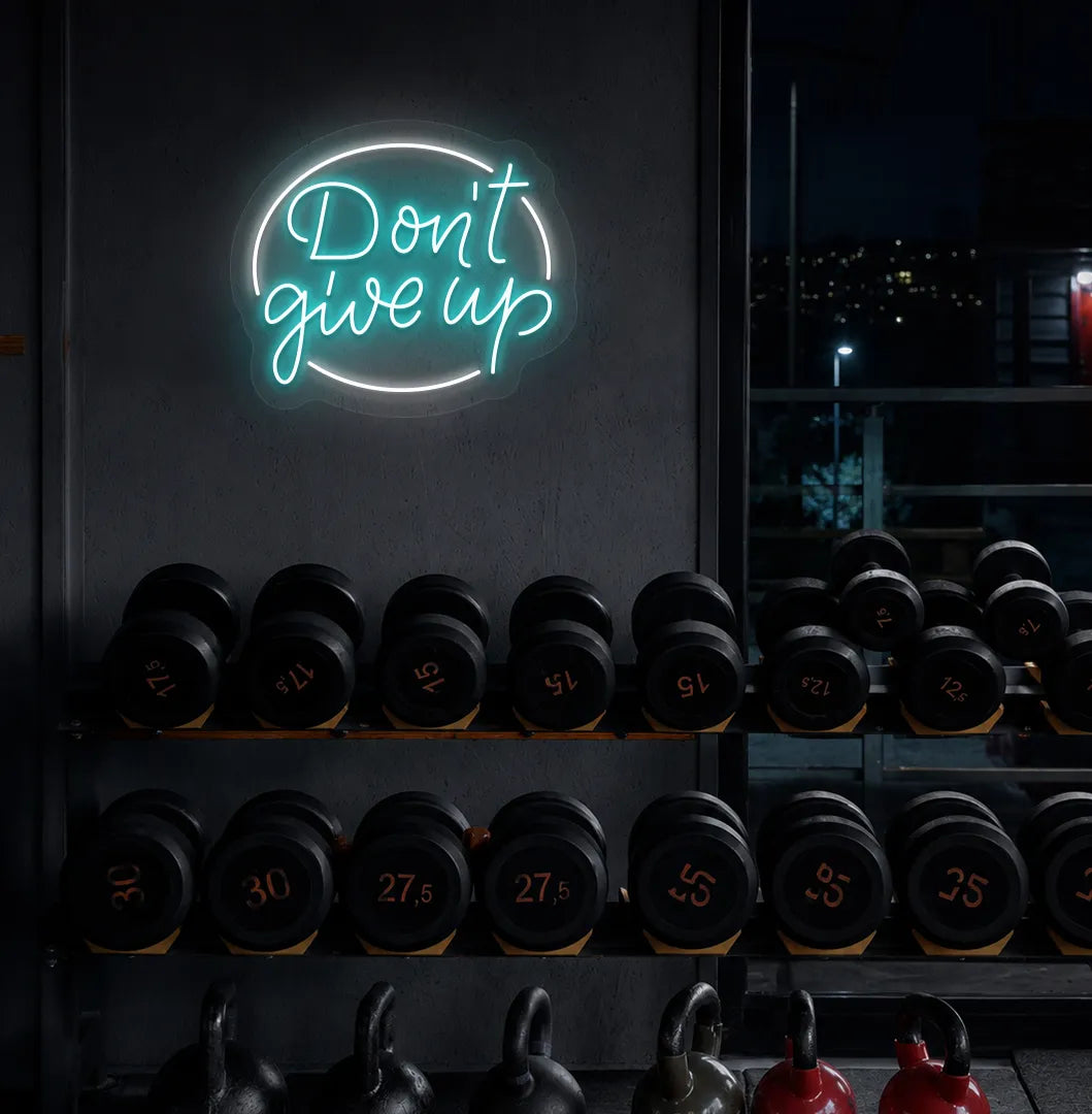 Image of an Aesthetic gym wall with "don't give up" neon sign glowing ice blue.