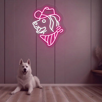 Image of a dog face with a hat LED neon sign mounted on a wall in pink color above a cute dog.