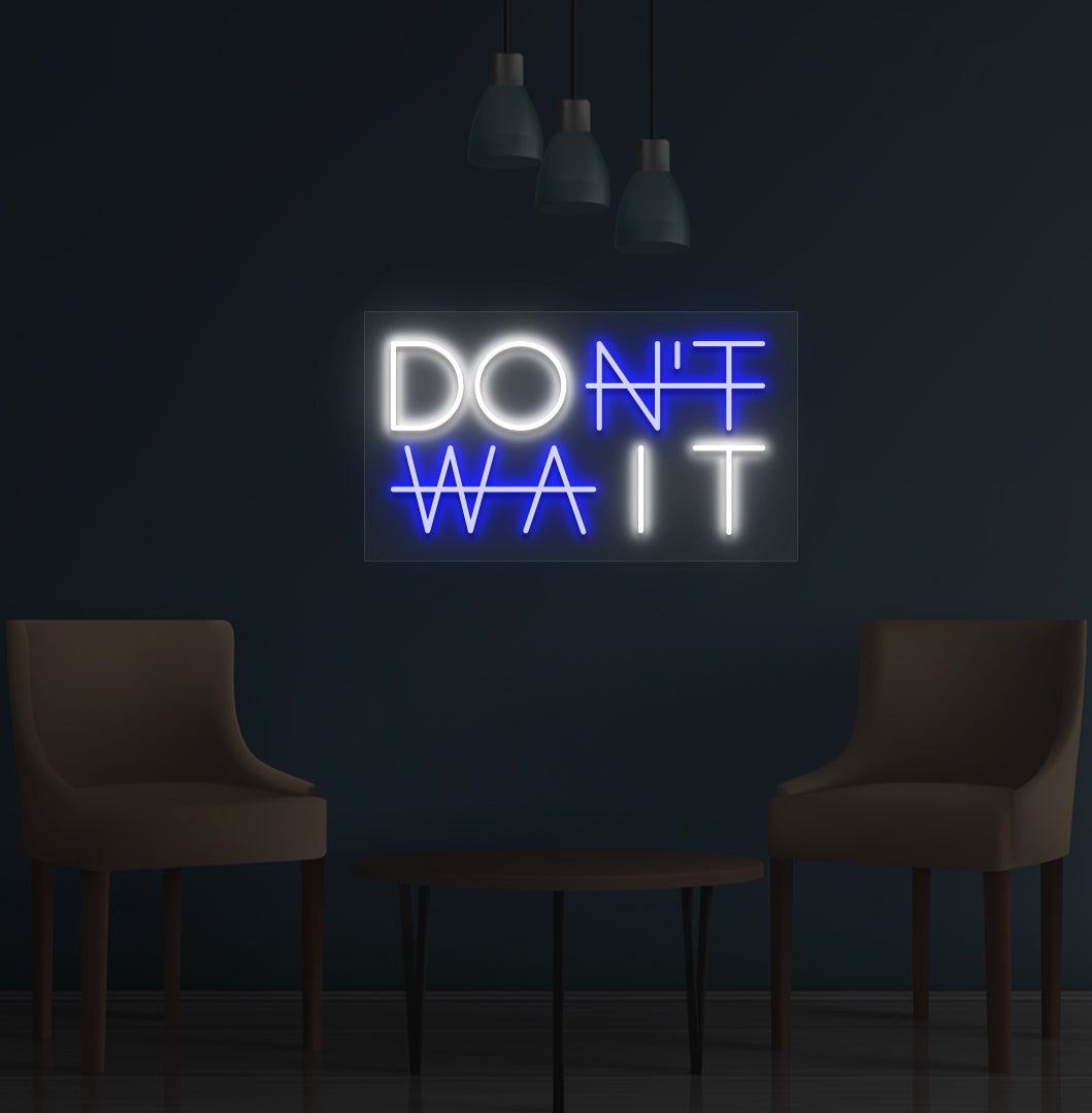 Image of a motivational "Don't Wait" LED neon sign mounted on a wall in blue color.
