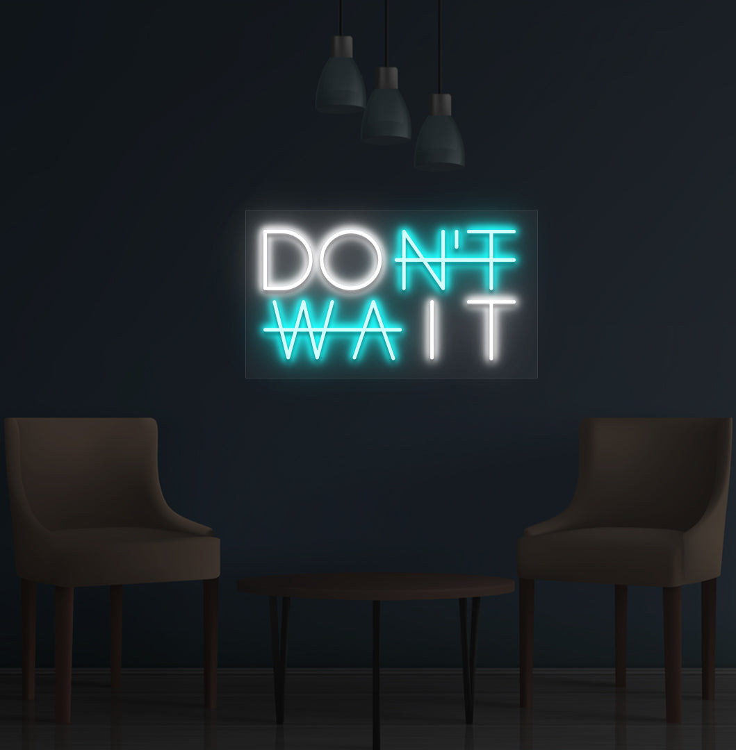 Image of a motivational "Don't Wait" LED neon sign mounted on a wall in ice blue color.