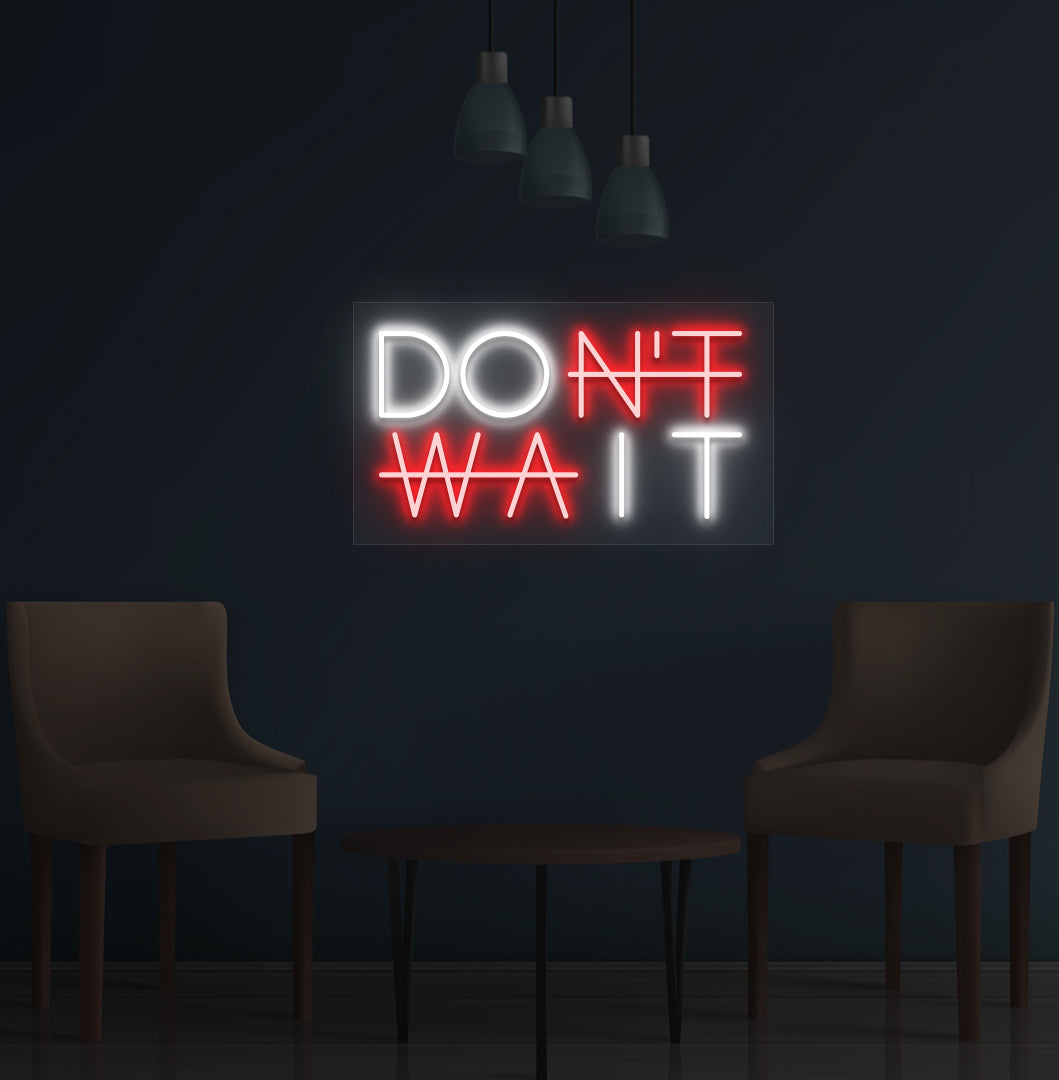 Image of a motivational "Don't Wait" LED neon sign mounted on a wall in red color.