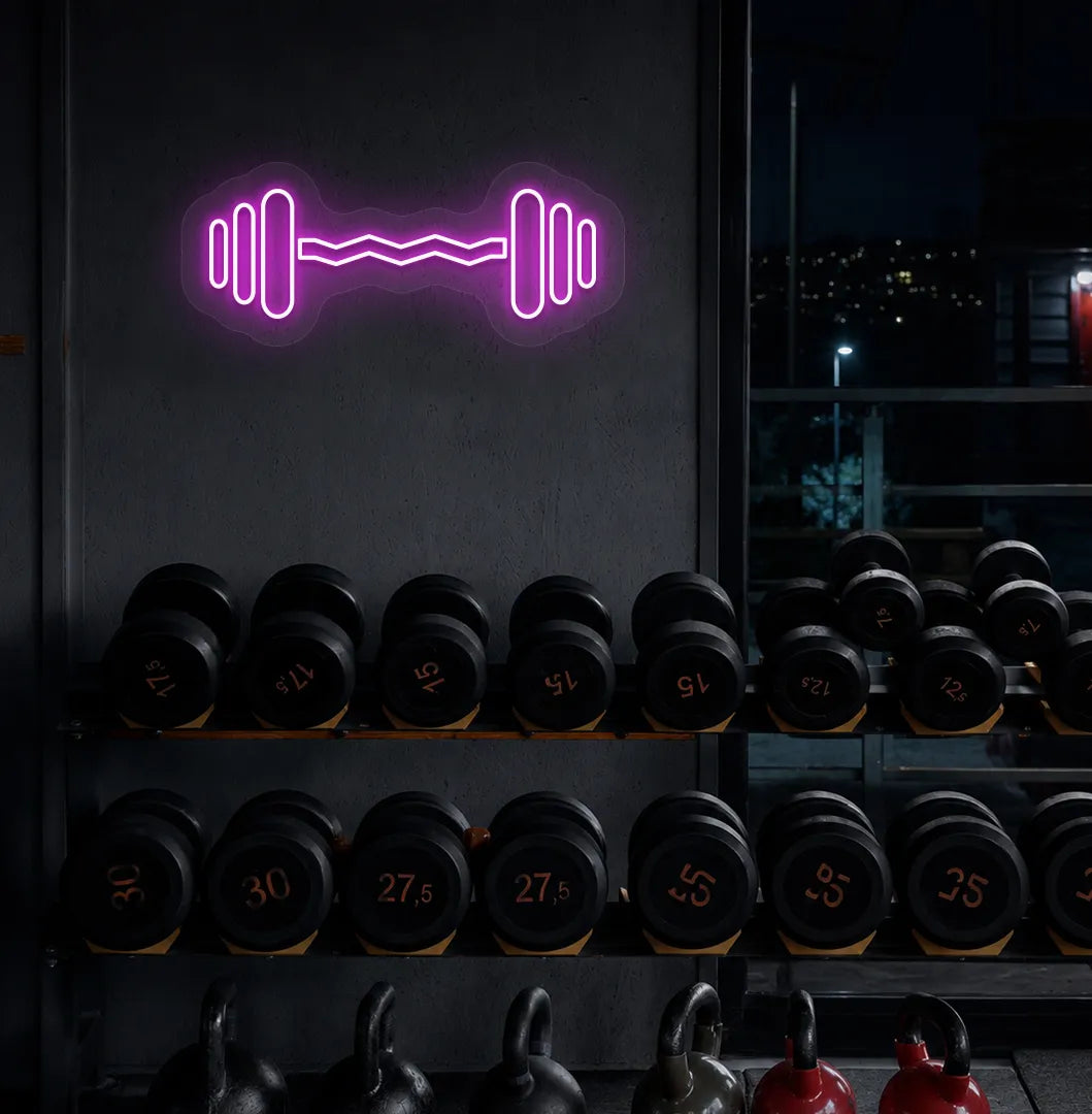 Image of an aesthetic gym wall with dumbbell neon sign glowing pink.