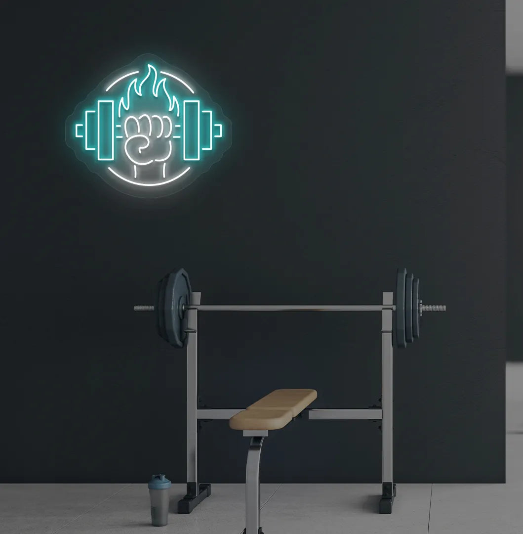 Image of a "Dumbbell in hand" neon sign in ice blue color mounted on gym wall.