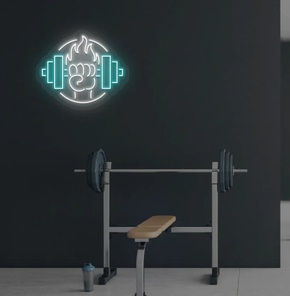 Image of a "Dumbbell in hand" neon sign in white color mounted on gym wall.
