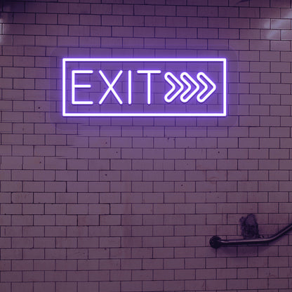 Directional purple LED exit neon sign hanging on the brick design wall.