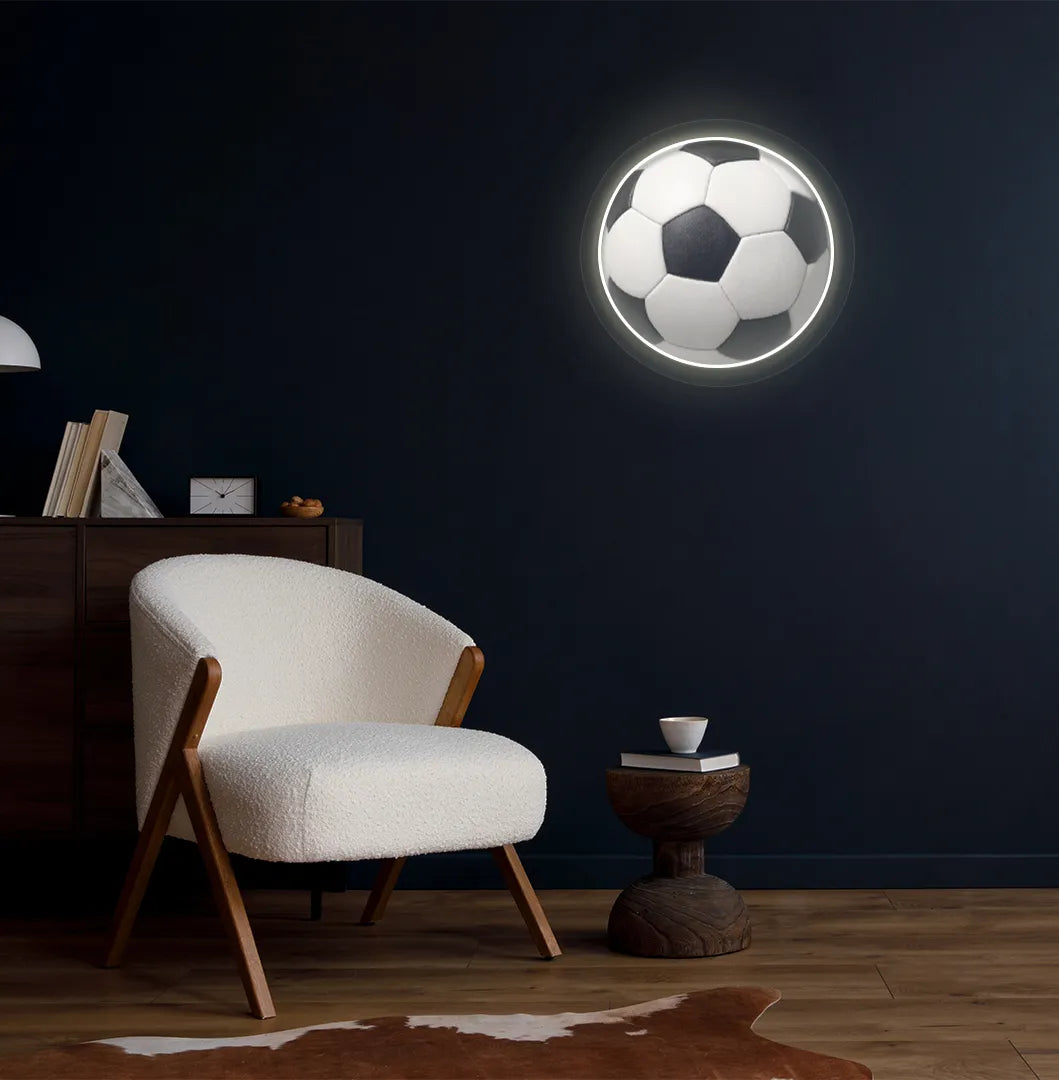 Modern football wall decor with FIFA football neon sign glowing warm white.