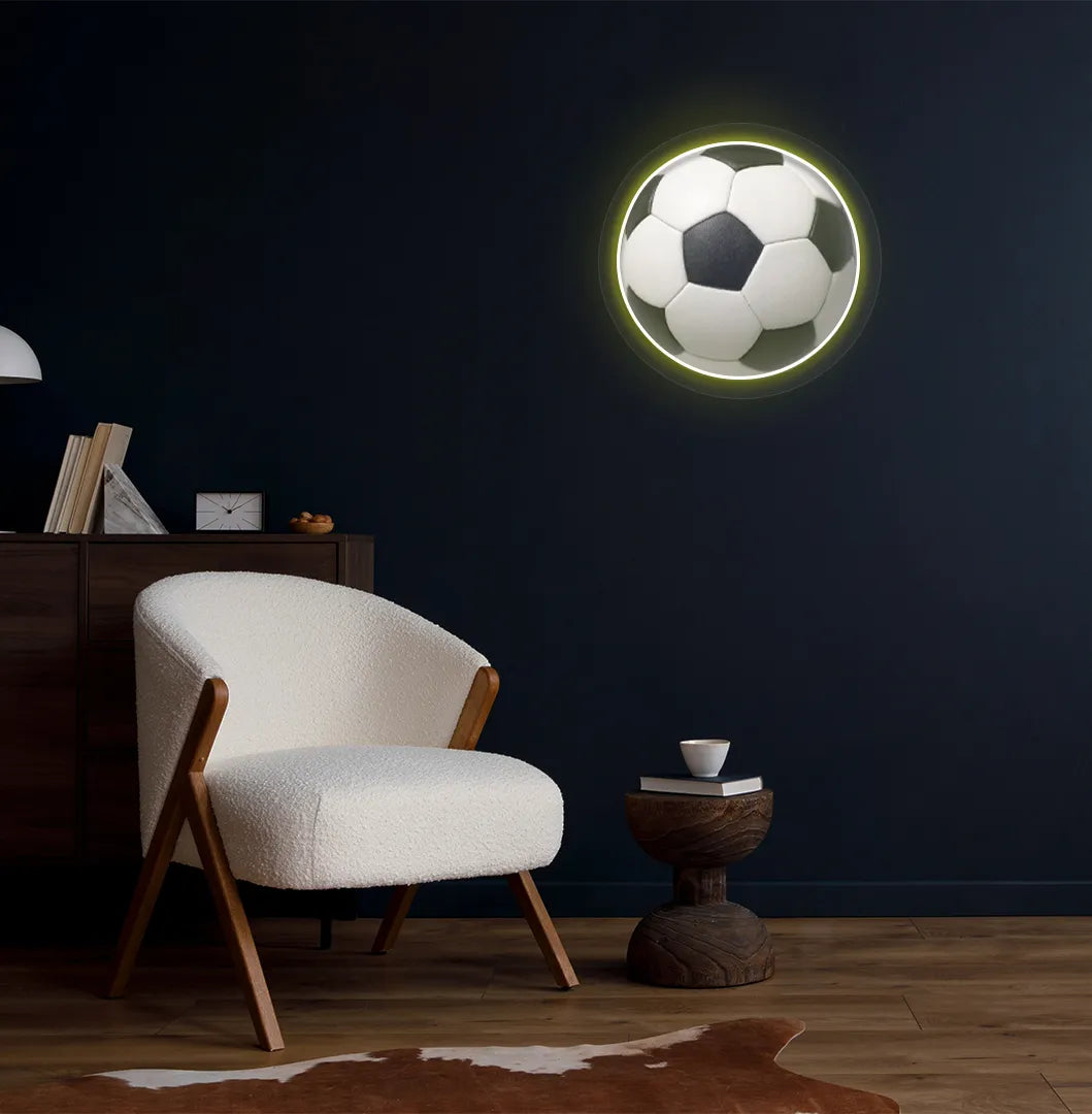 Modern football wall decor with FIFA football neon sign glowing yellow.