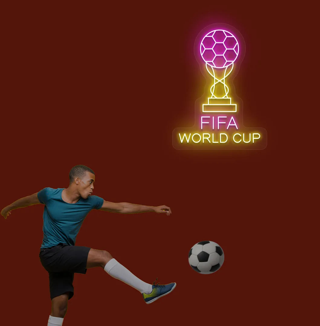 Image of "FIFA World Cup with trophy" neon sign mounted on aesthetic wall in pink color.