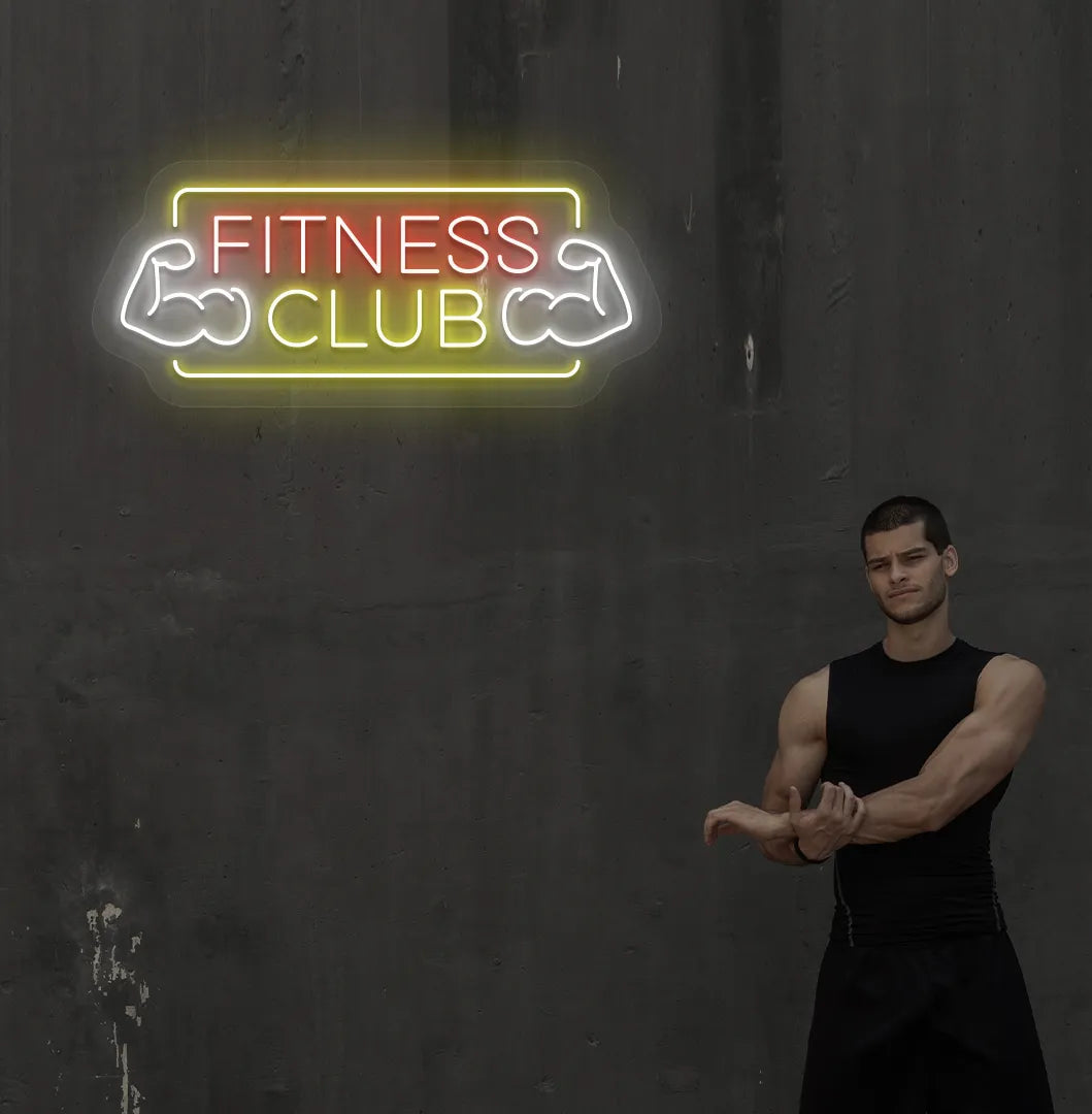 Image of an aesthetic gym wall with fitness club neon sign glowing red.