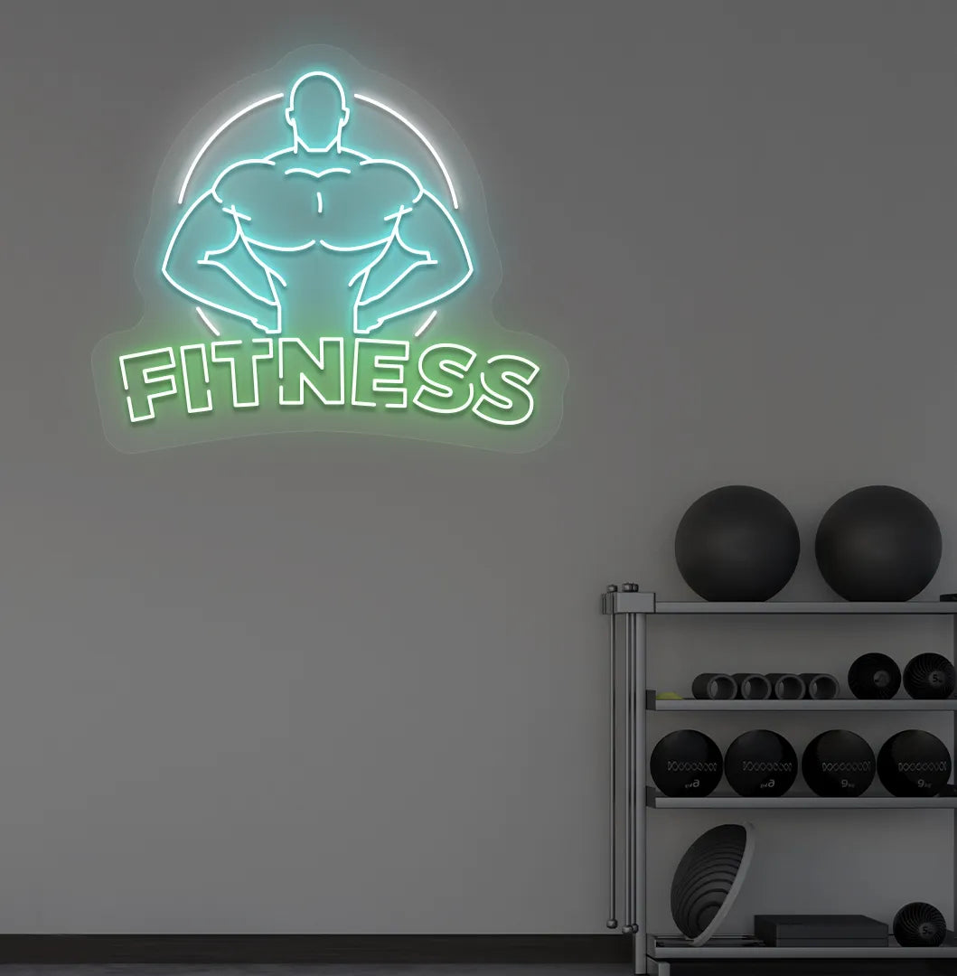 Trendy fitness neon sign in green mounted on fitness wall.