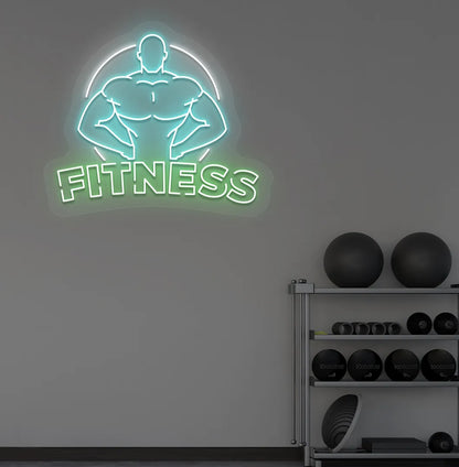 Trendy fitness neon sign in green mounted on fitness wall.