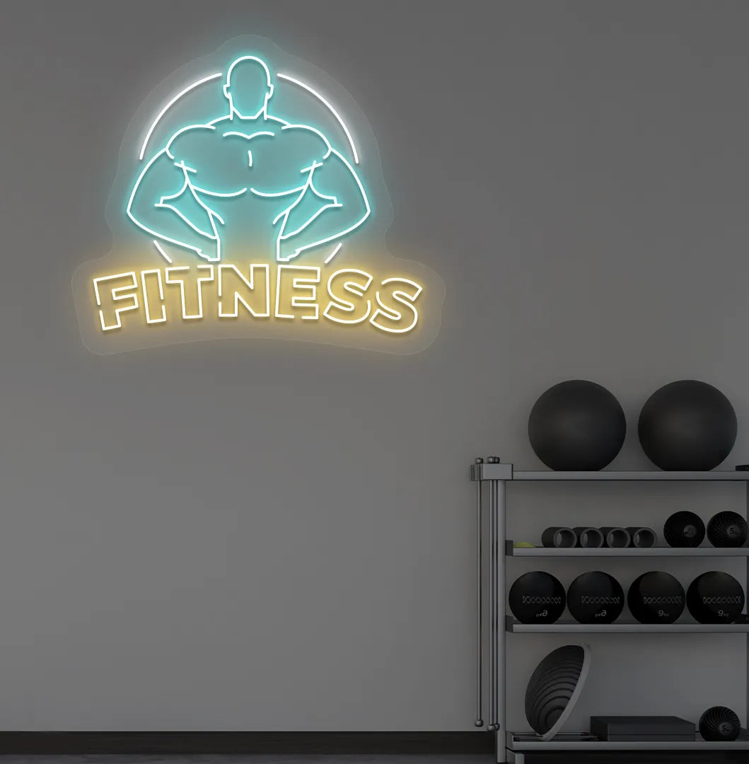 Trendy fitness neon sign in orange mounted on fitness wall.