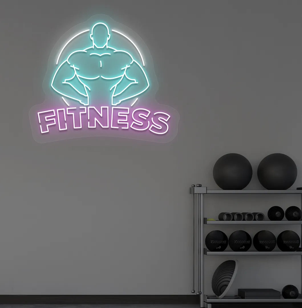 Trendy fitness neon sign in purple mounted on fitness wall.