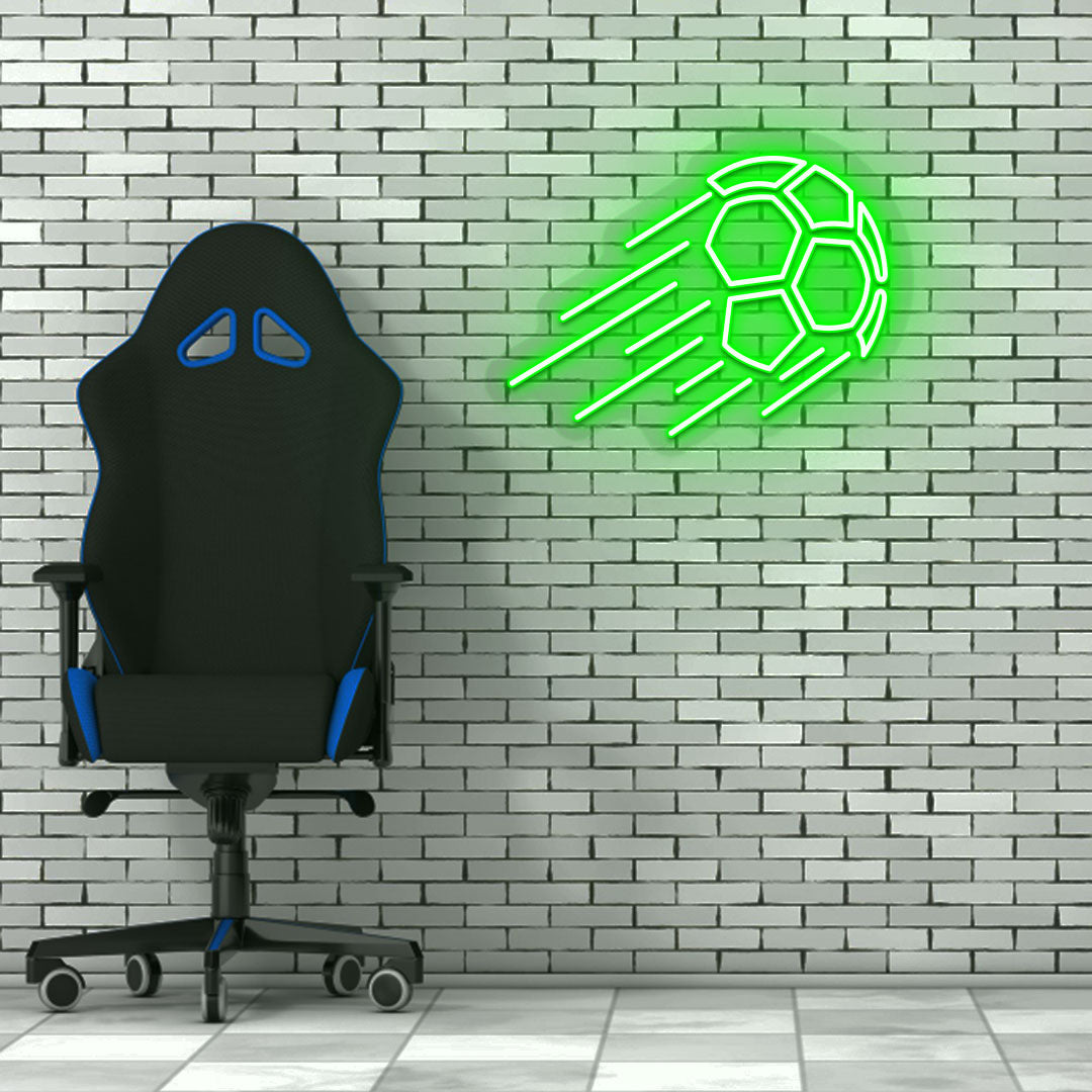 Image of a flying football neon sign in green LED on a brick design wall with a chair setup.