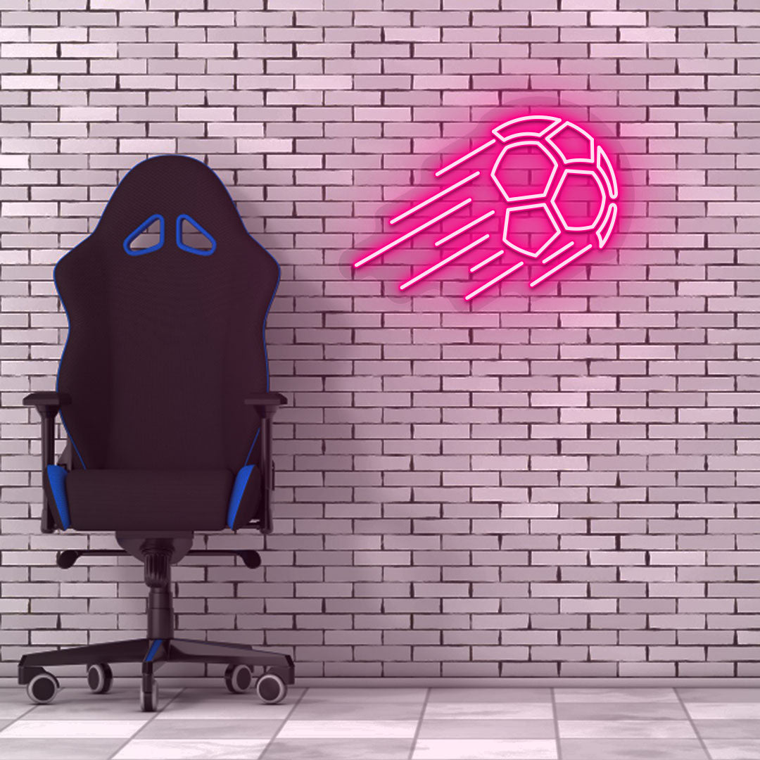 Game room decor with a pink flying football neon sign on a brick wall and a chair.