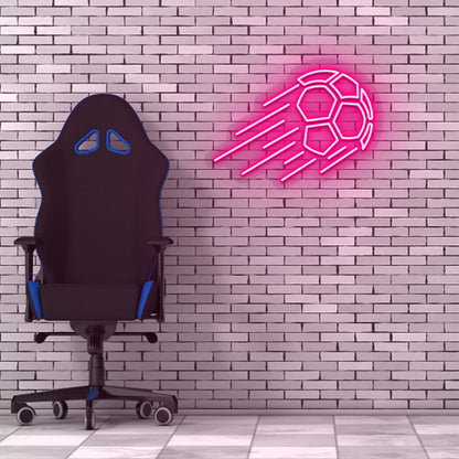 Game room decor with a pink flying football neon sign on a brick wall and a chair.