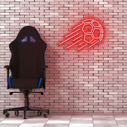 Image of a flying football neon sign in red LED on a brick design wall with a chair setup.