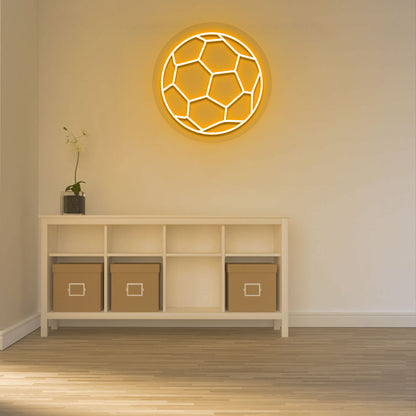 A bright orange football neon sign is glowing on the wall. perfect for game rooms, sports areas, living rooms, and sports cafés.