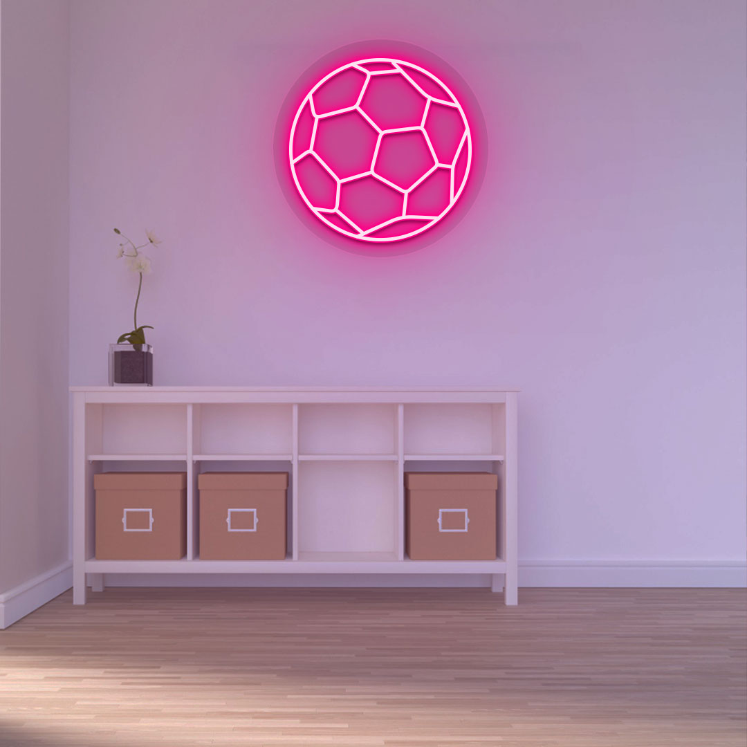 A stylish pink LED football neon sign is glowing on a wall. 