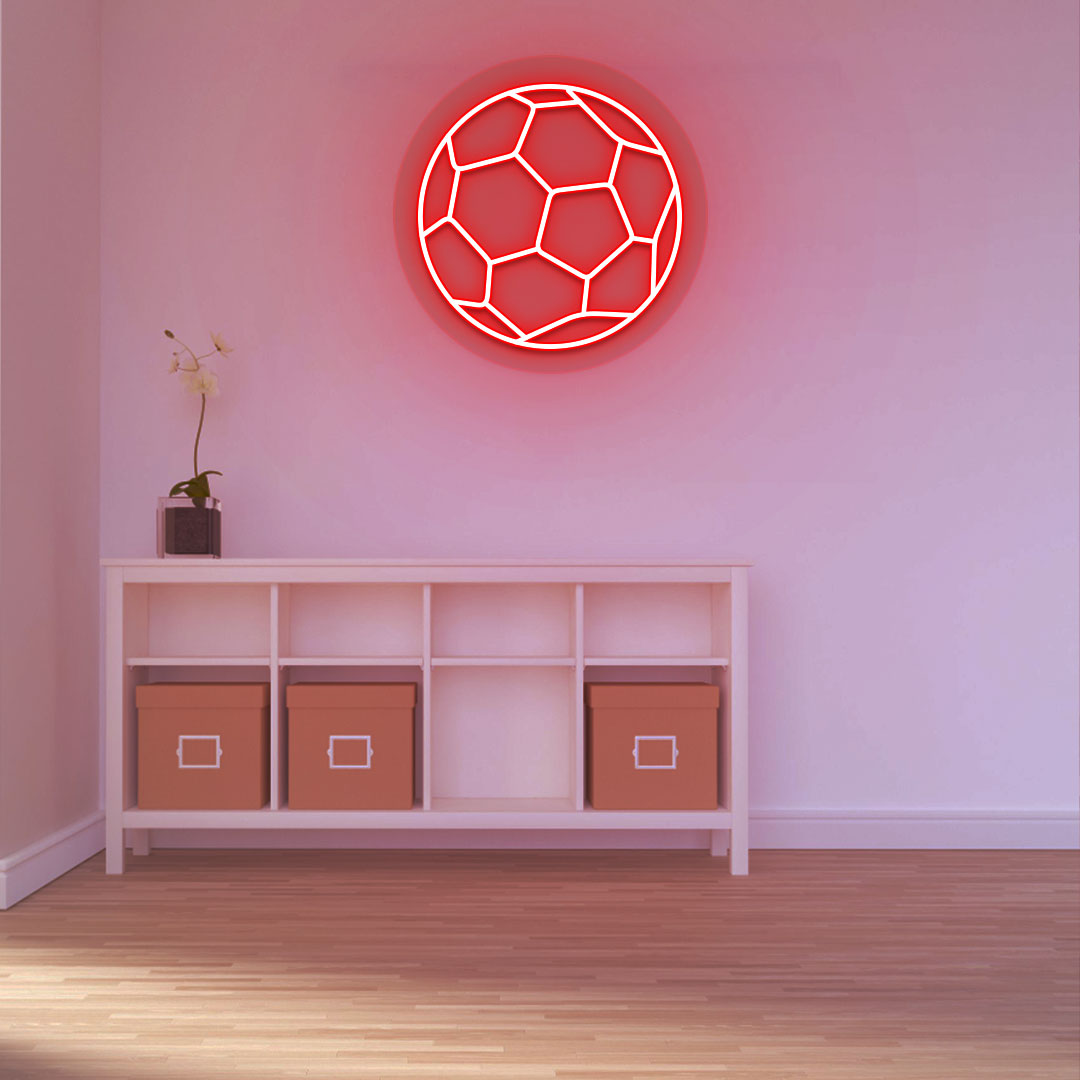 A stylish red LED football neon sign is glowing on a wall. 