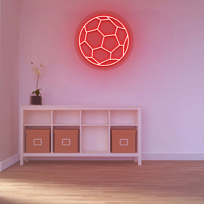 A stylish red LED football neon sign is glowing on a wall. 