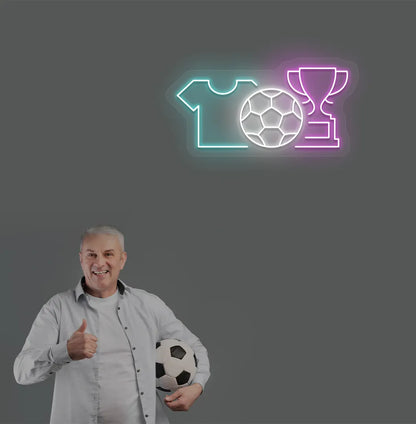 Image of a "football trophy and jersey" neon sign mounted on aesthetic wall in pink color.