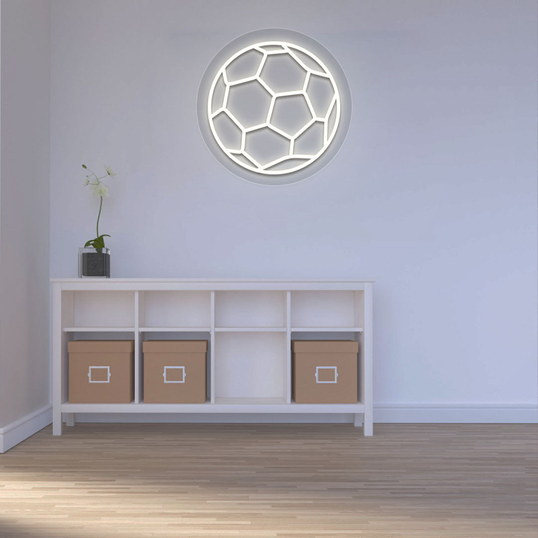 A bright warm white football neon sign is glowing on the wall. perfect for game rooms, sports areas, living rooms, and sports cafés.