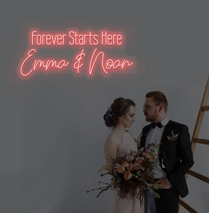 Romantic Forever Starts Here personalized name neon sign glowing red on aesthetic wall.