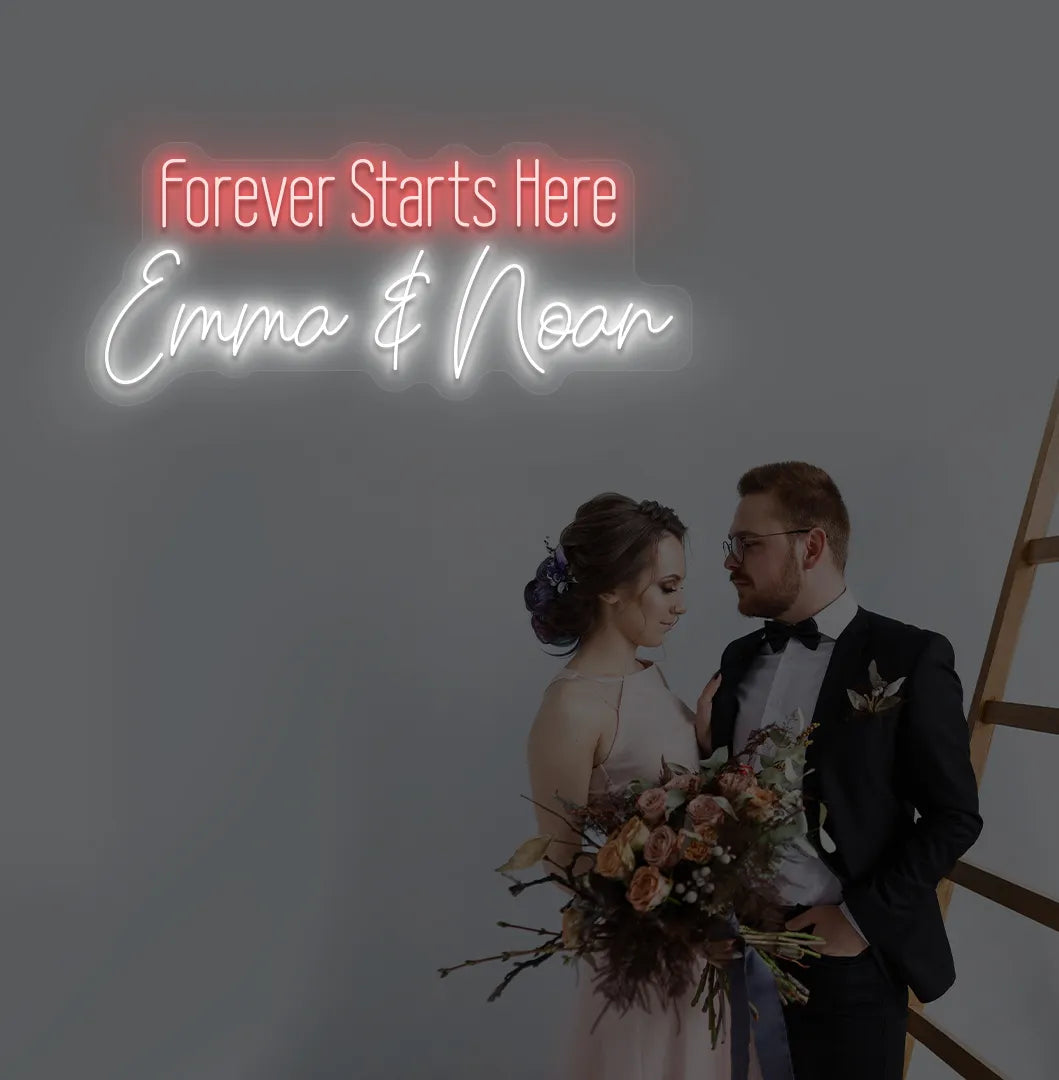 Romantic Forever Starts Here personalized name neon sign glowing white on aesthetic wall.