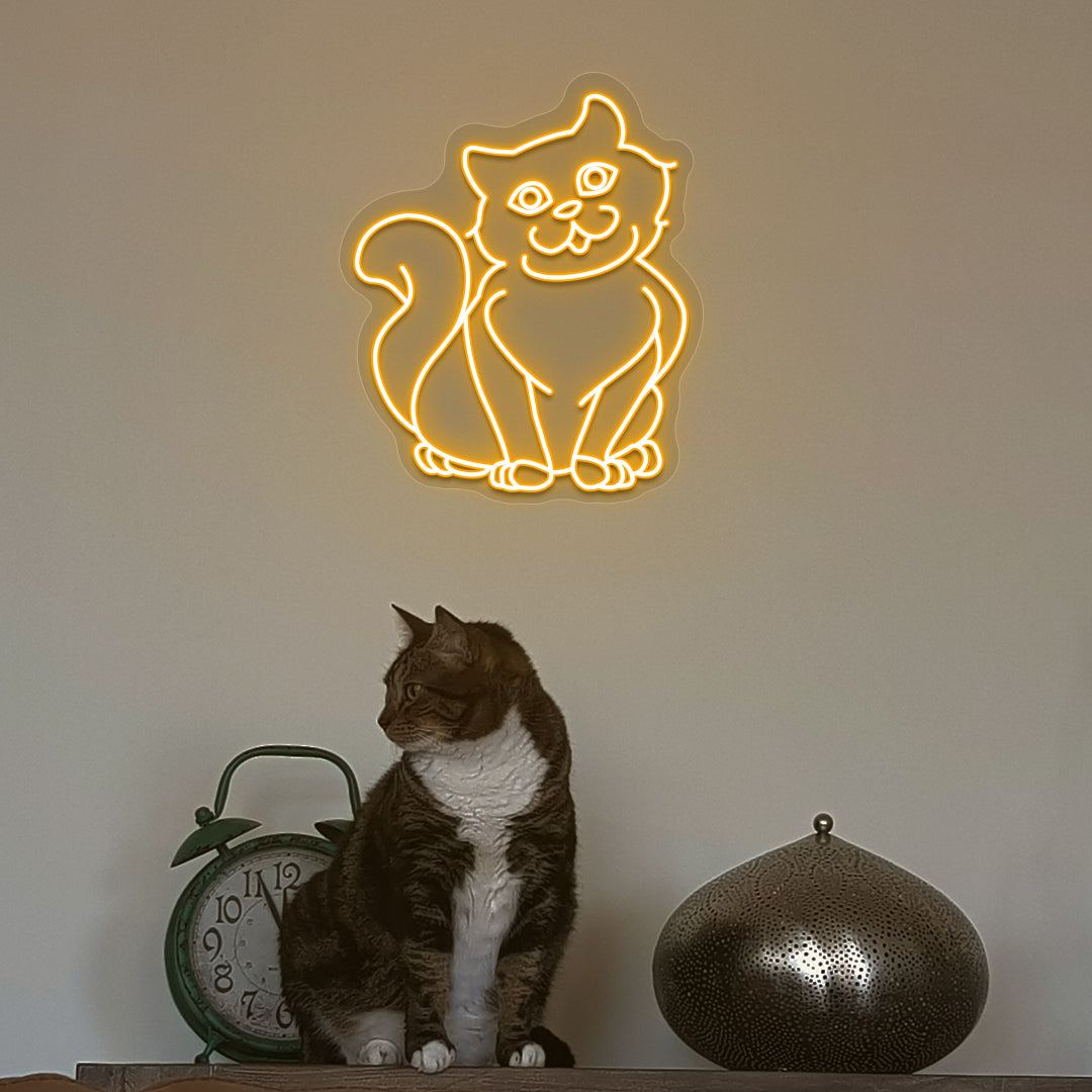 A stylish orange cat LED neon sign above a cute cat is mounted on the wall. Perfect for pet lovers, bedroom, living room décor, and kids’ rooms.