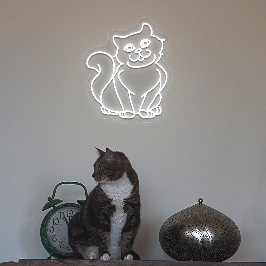 A stylish white cat LED neon sign above a cute cat is mounted on the wall. Perfect for pet lovers, bedroom, living room décor, and kids’ rooms.