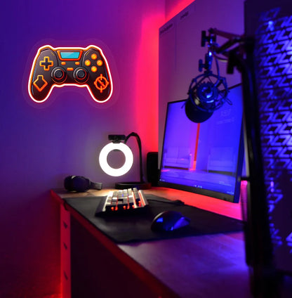 Image of a "Game controller" neon sign in red color mounted on gaming room wall.