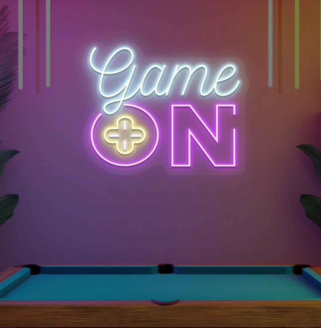 Image of a "game on" LED neon sign glowing on an aesthetic wall in ice blue.