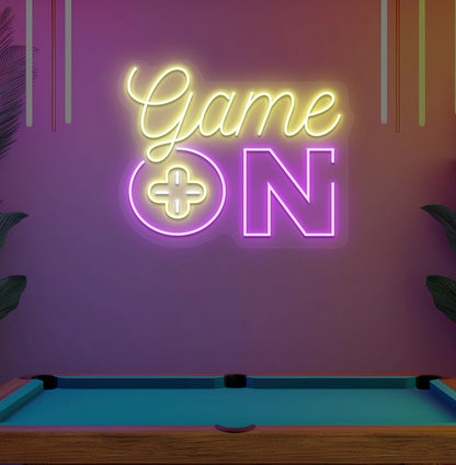 Game On neon sign glowing yellow on aesthetic wall in home entertainment area