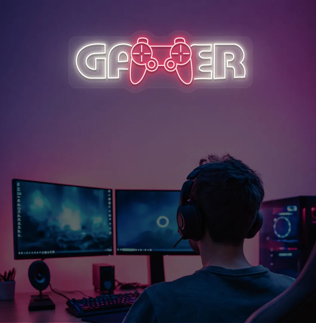 Trendy Gamer neon sign mounted on entertainment room wall in warm white color.